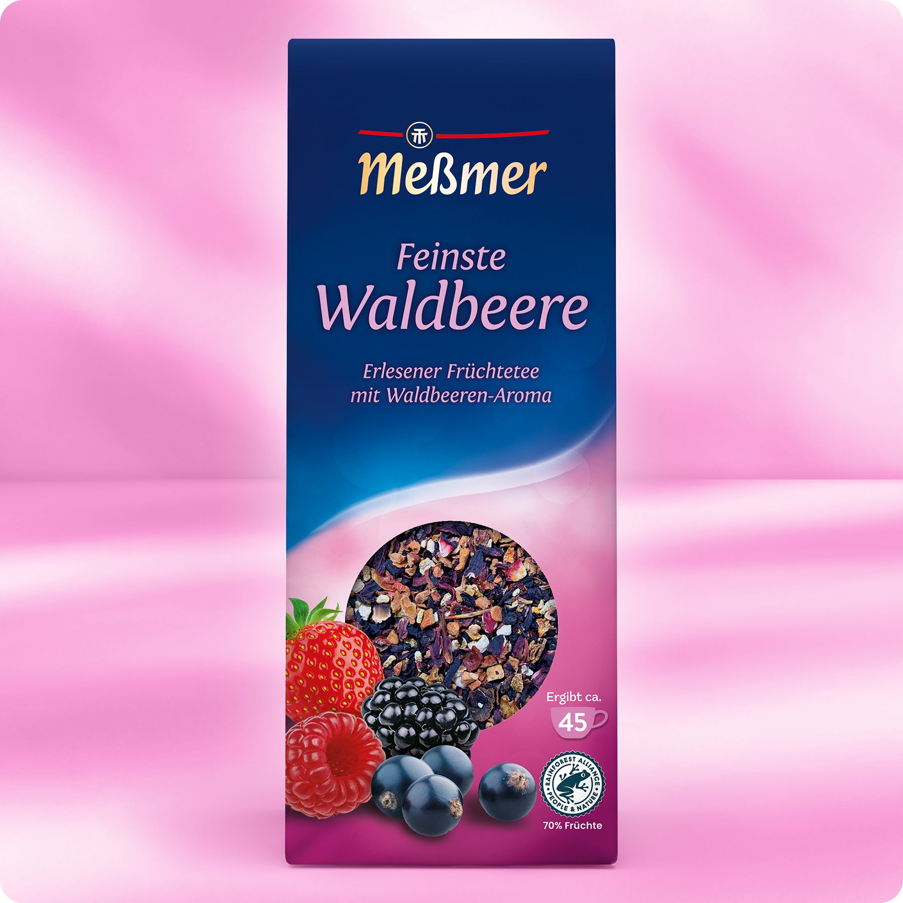 Schachtel Meßmer DE Feinste Waldbeere Teeservice mit rosa Hintergrund und Abbildungen von Erdbeeren, Himbeeren, Brombeeren und Heidelbeeren sowie einem runden Fenster, das die fruchtige Waldbeere-Mischung zeigt.