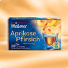 Verpackung von Aprikose-Pfirsich Früchtetee mit Darstellung mehrerer Pfirsich- und Aprikosenscheiben über einem Glas mit goldenem Tee, Hinweis auf mild-fruchtigen Geschmack und Care-for-Tea-Siegel.