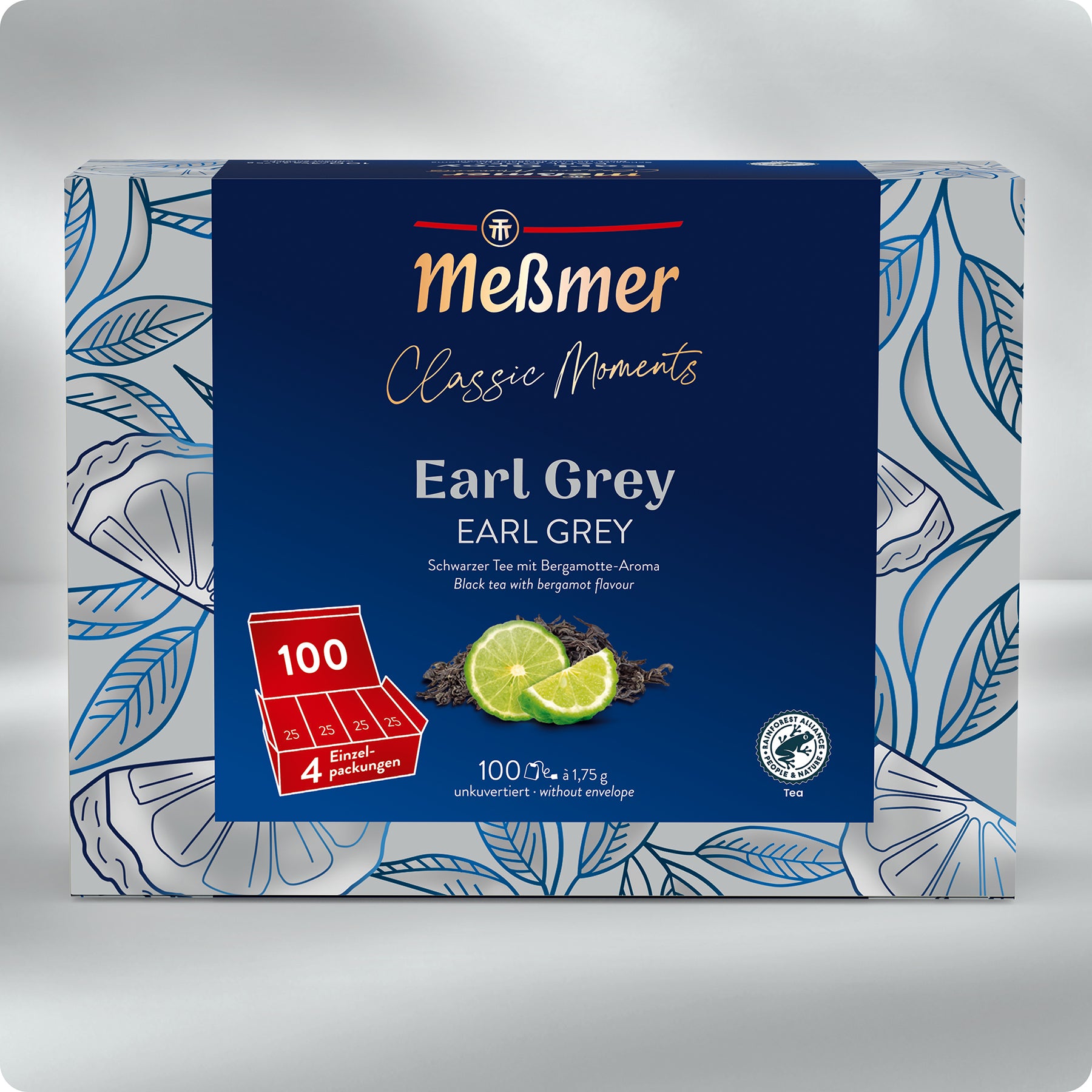 Eine Schachtel Meßmer DE Earl Grey zeigt ein blau-weißes Blumendesign mit Limettenscheiben und schwarzen Teeblättern. Die Packung enthält 100 Teebeutel (4 Packungen), ist mit feiner Bergamotte aufgegossen und trägt sowohl ein deutsches als auch ein englisches Etikett.