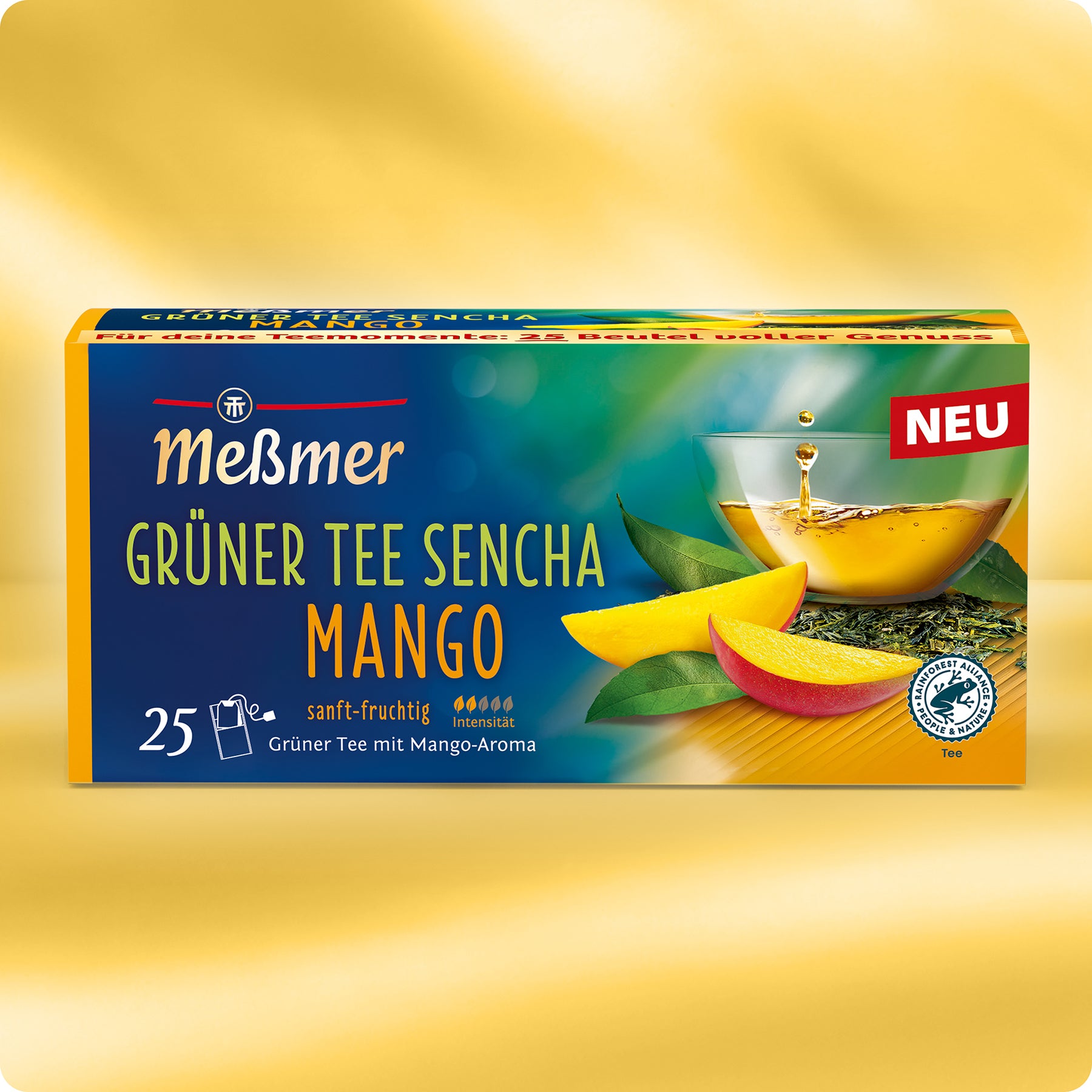 Meßmer DE Grüner Tee Sencha Mango enthält 25 Teebeutel in einer Schachtel mit einer Tasse Tee, Mangoscheiben und Teeblättern auf der Verpackung, die seinen sanften, fruchtigen Mangogeschmack hervorheben.